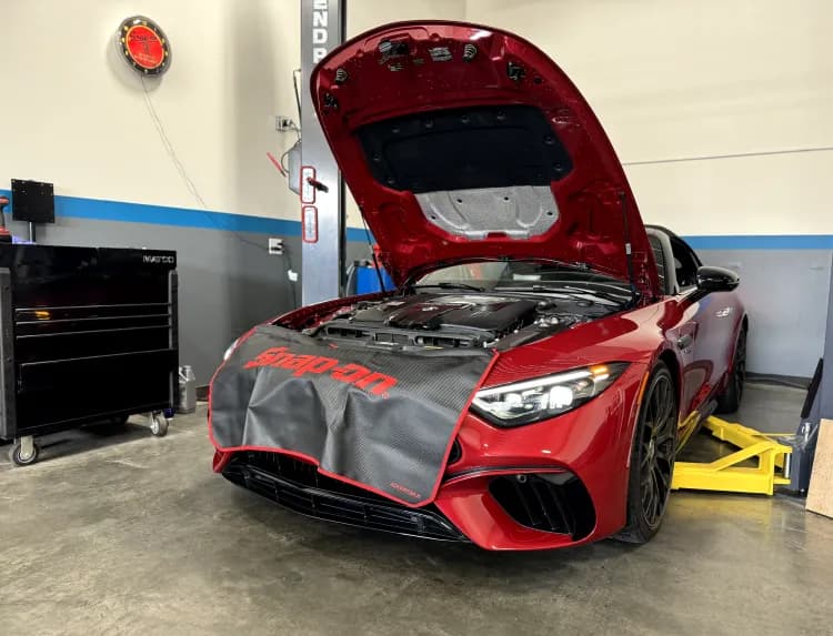 Mercedes-AMG SL on a lift with the hood open inside the Euro Performance shop