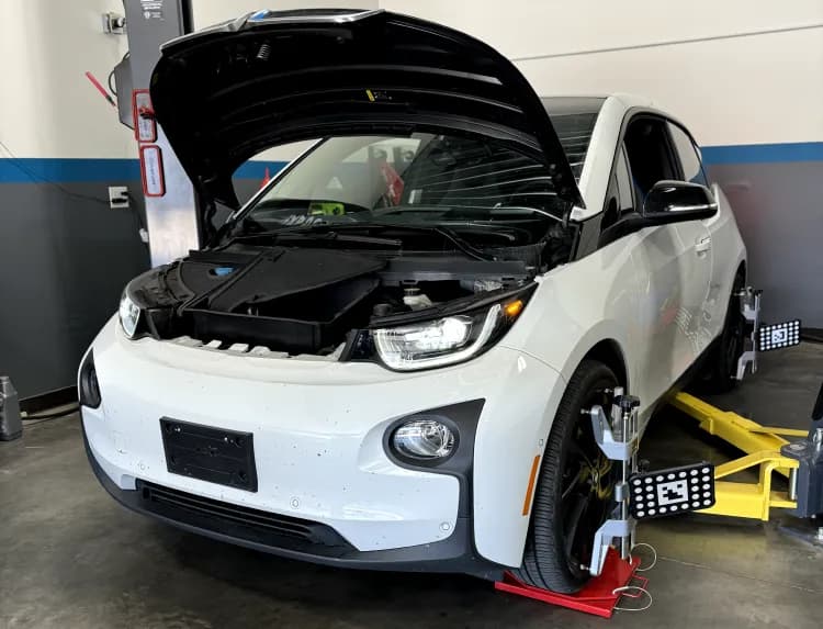 BMW i3 on the alignment rack with wheel targets