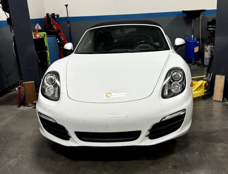 White Porsche Boxster in the shop